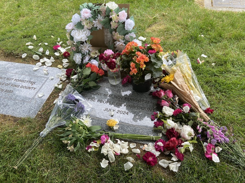 caption: During an indigent remains ceremony at Mt. Olivet Cemetery in Renton, Washington, the King County Medical Examiner's Office honored the lives of 405 residents.
